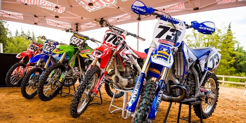 2 Stroke Dirt Bikes Standing In A Row
