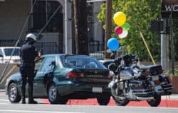 Cop sites driver with balloons