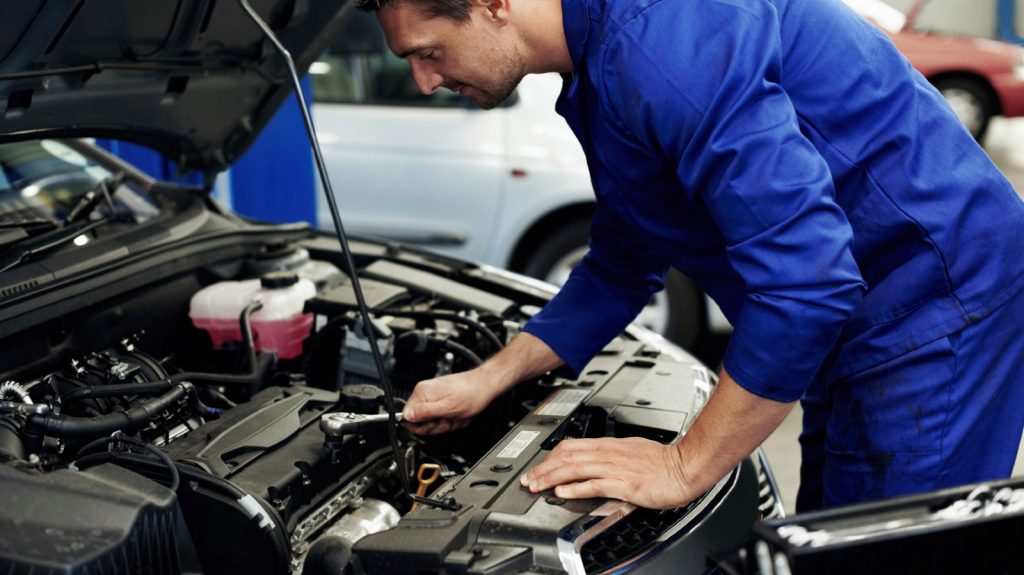 mechanic repairing car