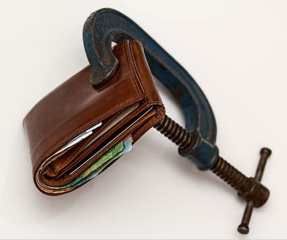 Clamp On Wallet Illustrating Hidden Fees