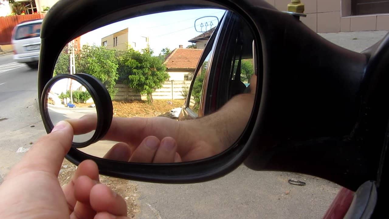 Person installing a convex mirror